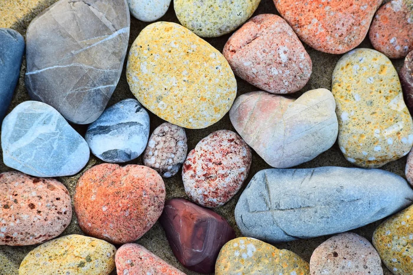 Smooth river pebbles packed closely together
